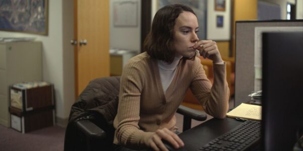 Daisy Ridley using a computer at her desk in Sometimes I Think About Dying | Agents of Fandom