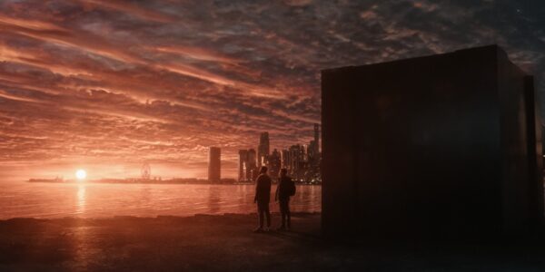 Joel Edgerton and Dayo Okeniyi standing outside the box gazing over the water and skyline in Dark Matter Episode 5 | Agents of Fandom
