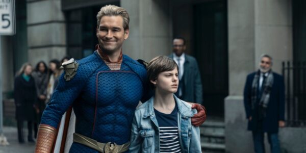 Homelander with his arm around his son Ryan standing in the street in The Boys Season 4 | Agents of Fandom