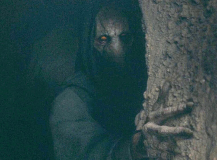Darth Plagueis peaking out from a cave in The Acolyte | Agents of Fandom