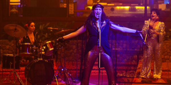 Kathryn Hahn singing in '70s outfit with aubrey plaza on drums and Patti LuPone on Maracas | Agents of Fandom