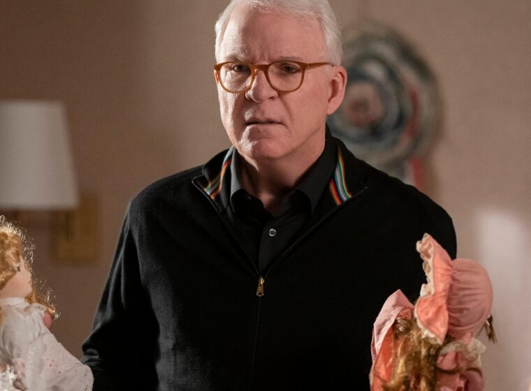 Steve Martin holding a doll in Only Murders in the Building Season 4 | Agents of Fandom