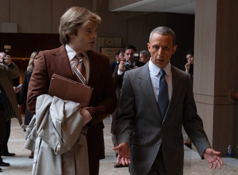 Sebastian Stan as Donald Trump and Jeremy Strong as Roy Cohn walking and talking in The Apprentice | Agents of Fandom