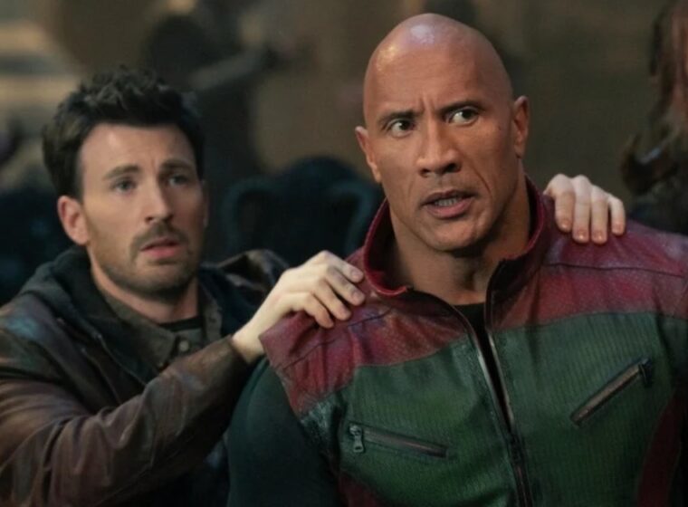 Chris Evans with his hands on The Rock's shoulders in Red One | Agents of Fandom