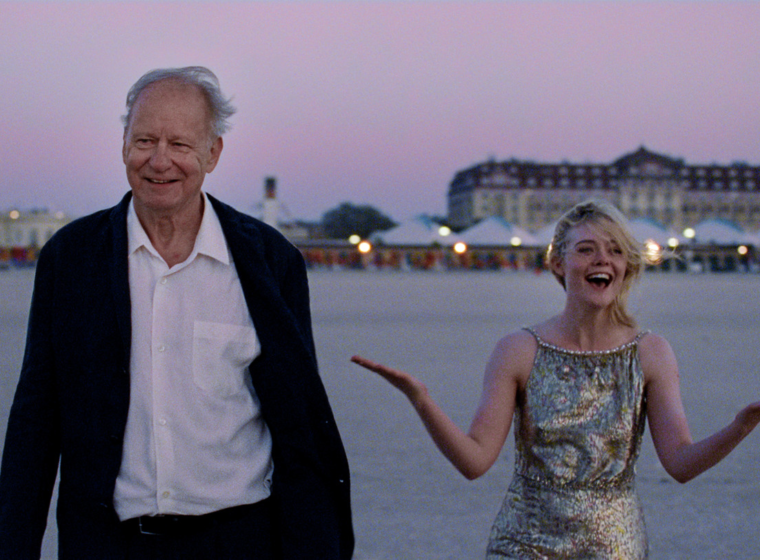 Gustav (Stellan Skarsgård, left) and Rachel Kemp (Elle Fanning, right) experience a magical meeting during an international film festival in Sentimental Value | Agents of Fandom