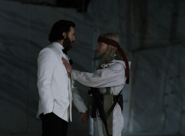 Anya Taylor-Joy holds her arm on Chris Evans' chest as they hold hands and stare into each others' eyes in 'Sacrifice' | Agents of Fandom