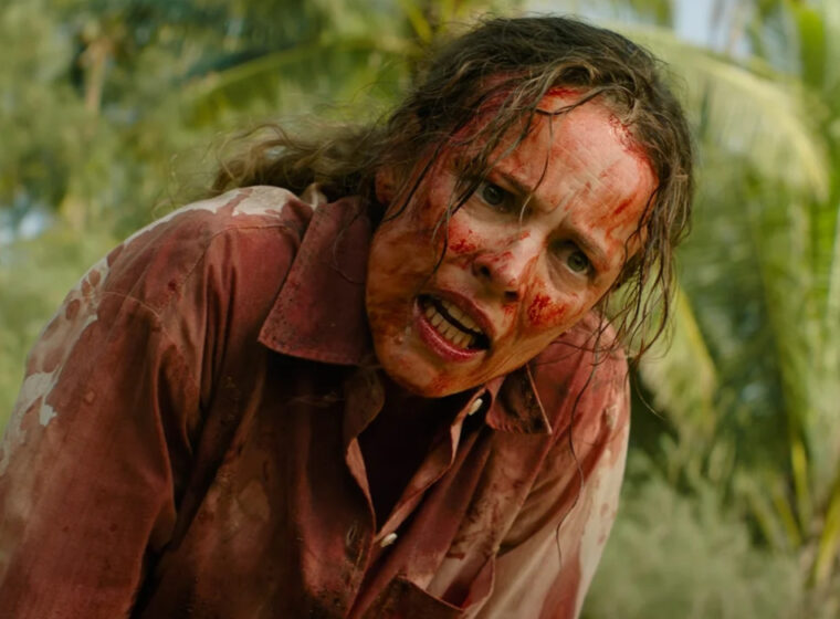 A very bloody Linda Liddle (Rachel McAdams) looks angry with a forest behind her in Send Help | Agents of Fandom
