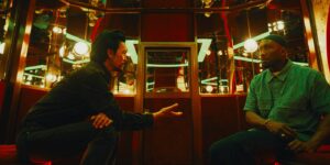 Haun Yoon (John Cho) and Latif (Mahershala Ali) having a tense standoff in a club in Your Mother Your Mother Your Mother | Agents of Fandom