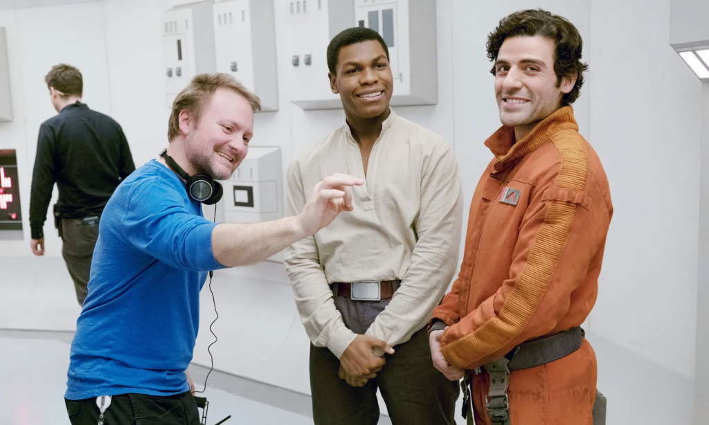 Director Rian Johnson, John Boyega (Finn), and Oscar Isaac (Poe Dameron) on the set of Star Wars: The Last Jedi.