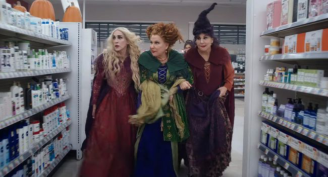 The Sanderson Sisters take a stroll through a pharmacy in Hocus Pocus 2.