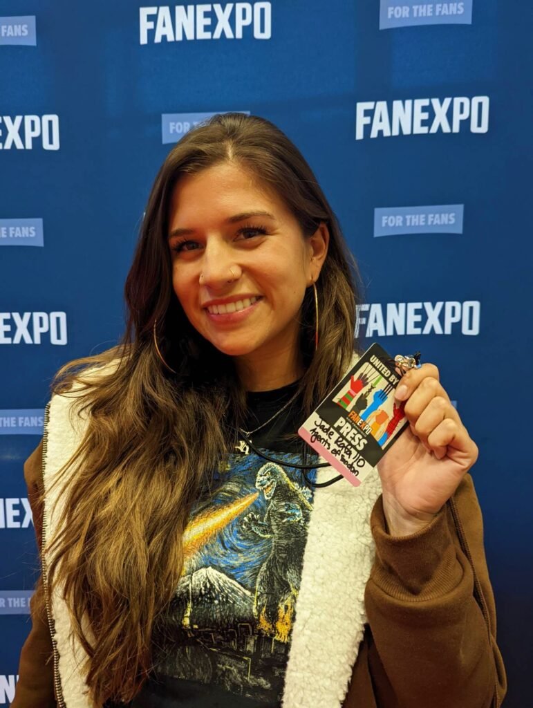 Agent Jade at the Fan Expo in SF smiling and holding a press pass - Agents of Fandom