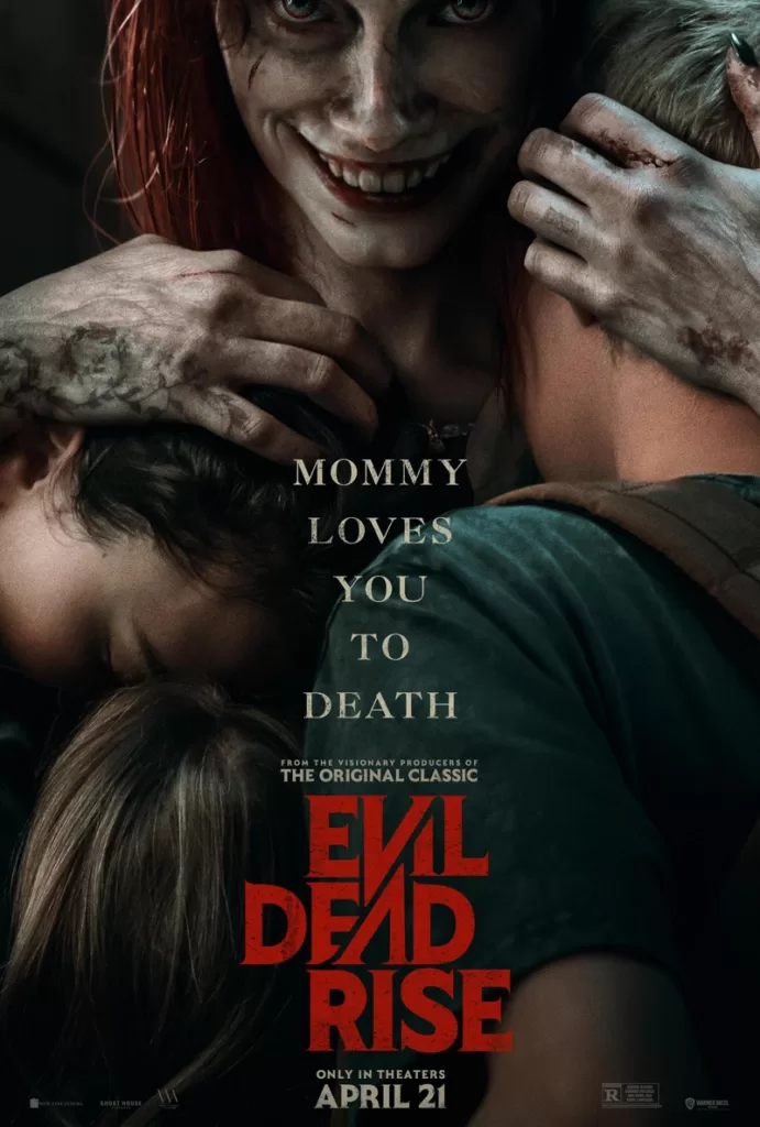 A mother hugging her kids with a sinister smile in the Evil Dead Rise poster | Agents of Fandom