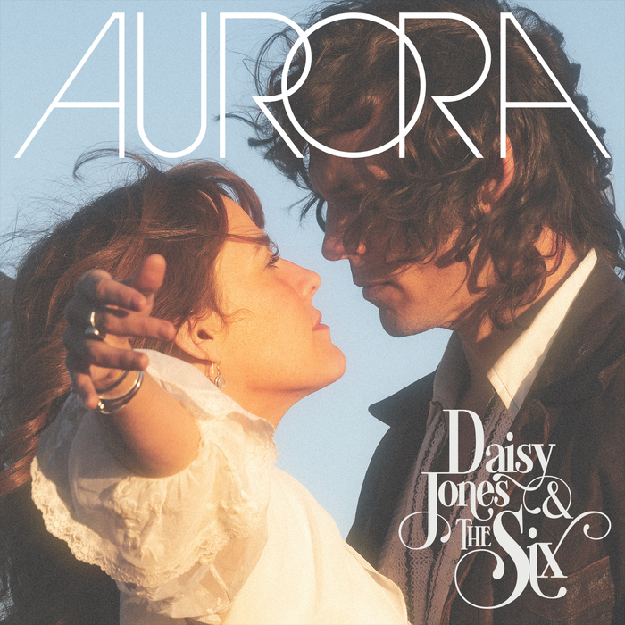 Daisy (Riley Keough) and Billy (Sam Claflin) on the Aurora album cover from Daisy Jones & the Six | Agents of Fandom
