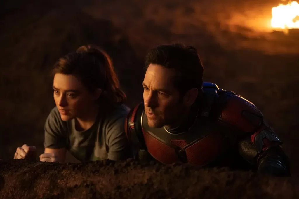 Kathryn Newton and Paul Rudd crouching next to each other in a scene in 'Ant-Man and The Wasp: Quantumania' | Agents of Fandom