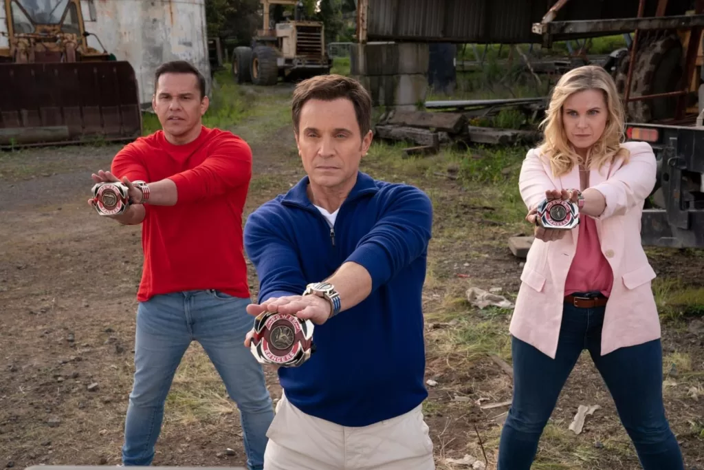 Steve Cardenas (left), David Yost (center) and Catherine Sutherland (right) holding their respective characters' Power Morphers " | Agents of Fandom"