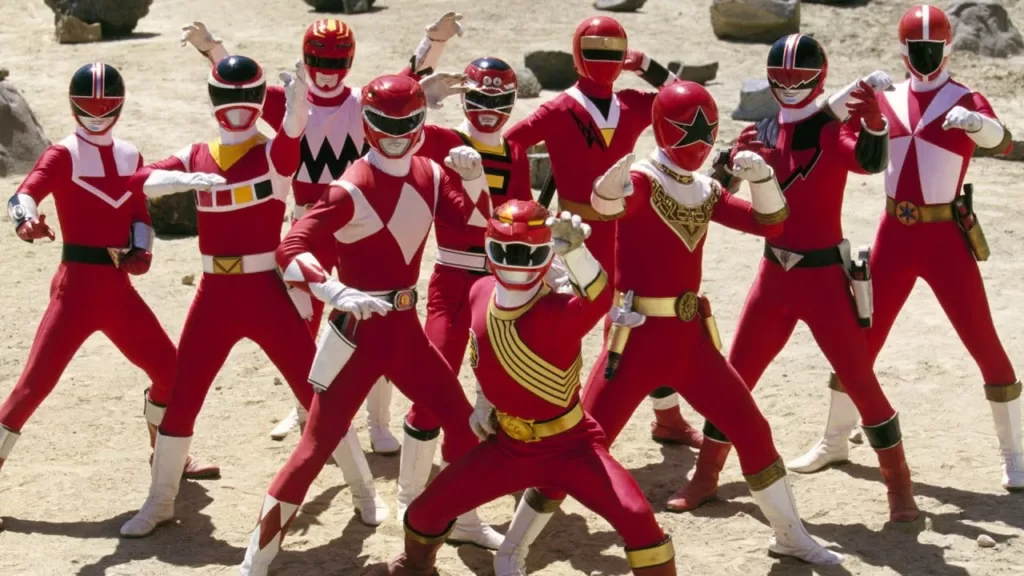 Ten different Red Rangers from the Power Rangers franchise posing in a promotional image for an episode of Power Rangers Wild Force | Agents of Fandom