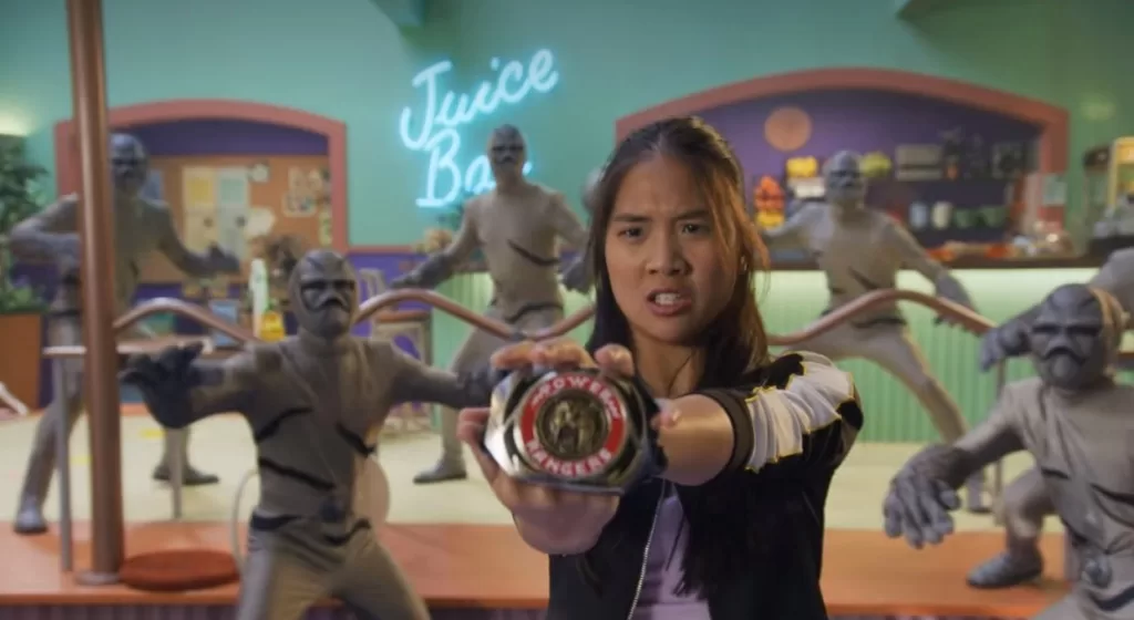 Minh Kwan (played Charlie Kersh) trying to use her mother's morpher to become the Yellow Ranger, as seen in the Power Rangers Netflix Special | Agents of Fandom