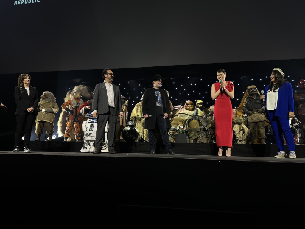 Daisy Ridley on stage at Star Wars Celebration to announce the future Rey Skywalker film. Pictured with Kathleen Kennedy, James Mangold, Dave Filoni, and Sharmeen Obaid-Chinoy | Agents of Fandom