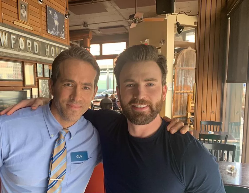 Ryan Reynolds and Chris Evans smiling for a picture on the 'Free Guy' set in regards to Ghosted cameos | Agents of Fandom