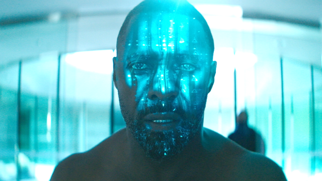 Idris Elba pictured in a lab during Fast & Furious Presents: Hobbs & Shaw | Agents of Fandom
