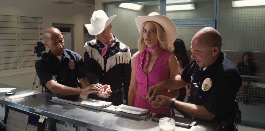 Ryan Gosling as Ken and Margot Robbie as Barbie at the police station in New  Barbie Movie Trailer | Agents of Fandom
