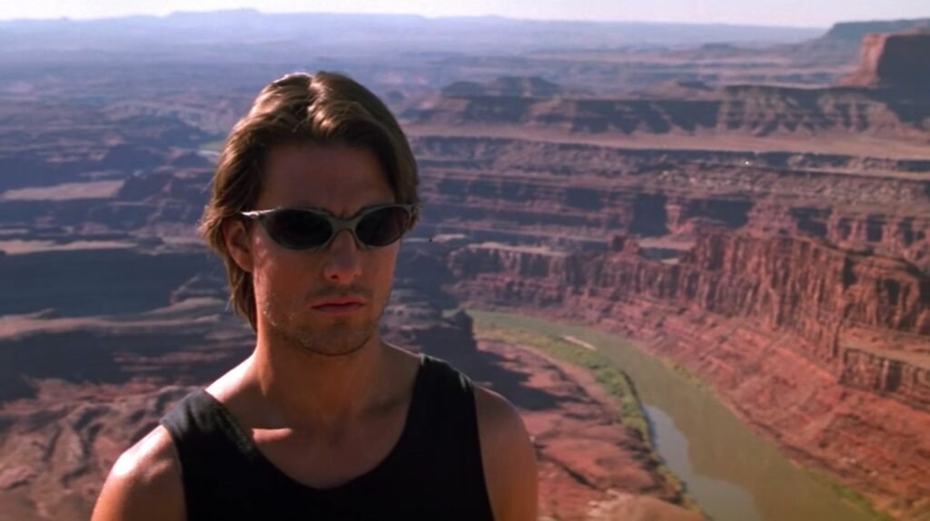 Ethan Hunt (Tom Cruise) rocks the ultimate pair of early 2000s spy sunglasses. | Agents of Fandom