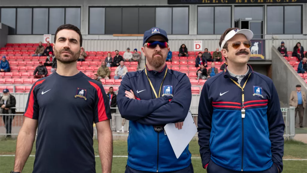 Coaches Roy Kent, Beard and Ted Lasso look on as AFC Richmond scrimmages in Ted Lasso episode 9. | Agents of Fandom