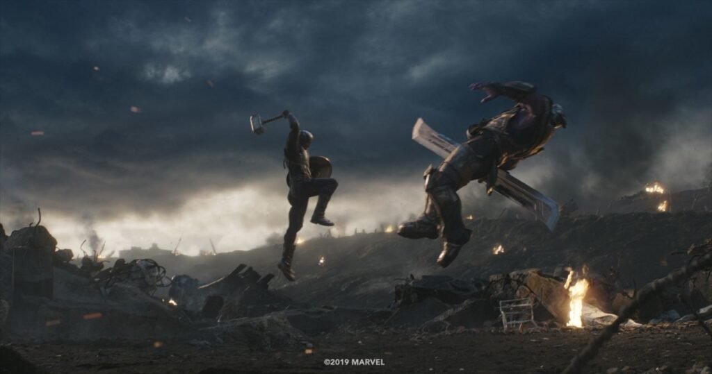 Number one best MCU fight scenes Captain America, wielding Mjolnir and shield (Left), knocks Thanos (right) into the air with a single hit in Avengers: Endgame | Agents of Fandom
