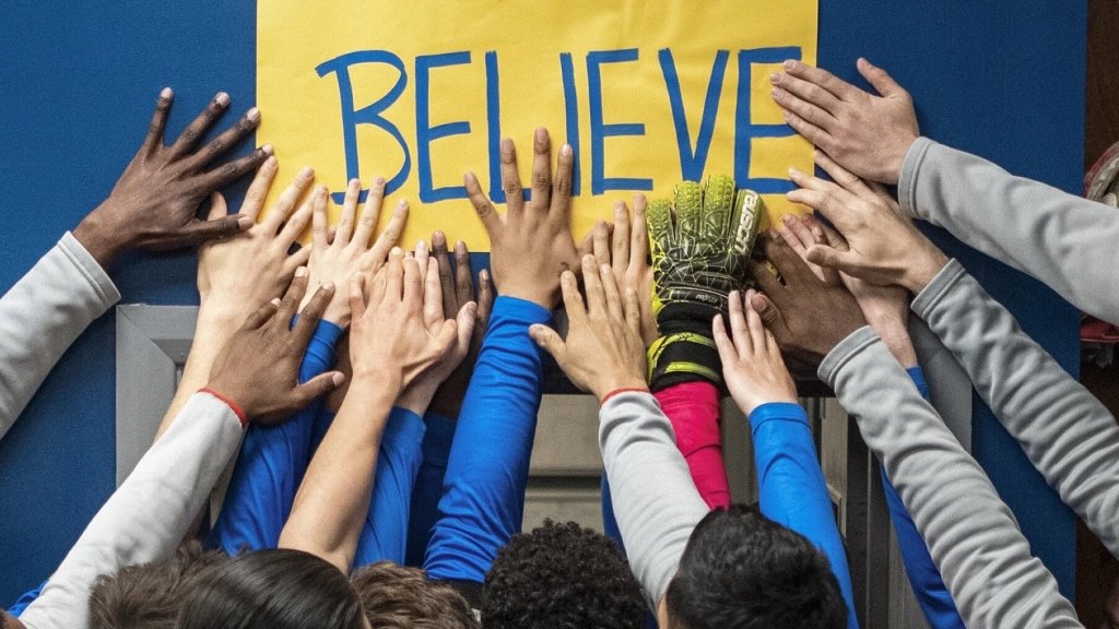The players of AFC Richmond touch the iconic 'Believe' sign in their locker room | Agents of Fandom