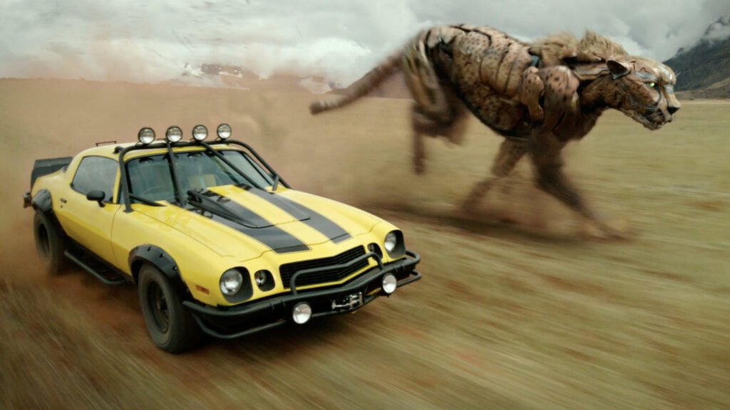Bumblebee (left), in his Camaro vehicle mode, alongside Cheetor (right), in his Cheetah beast mode in Transformers: Rise of the Beasts | Agents of Fandom