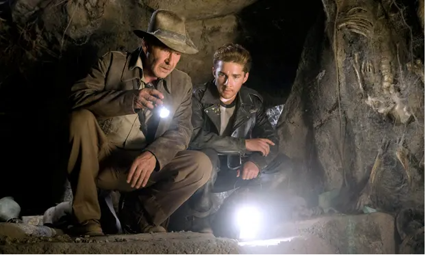 Indiana Jones (Harrison Ford, left) and Mutt Williams (Shia LaBeouf, right) explore ancient caves in Indiana Jones and the Kingdom of the Crystal Skull I Agents of Fandom