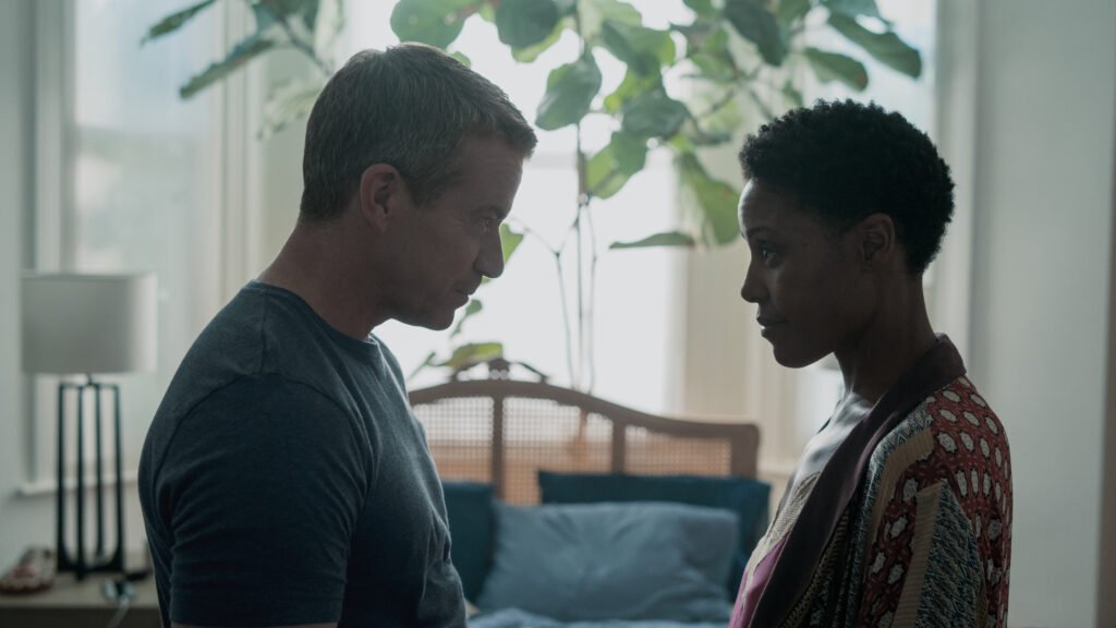 Max Beesley as Daniel Farrell and Christine Adams as Marsha Nelson-Smith in Hijack | Agents of Fandom