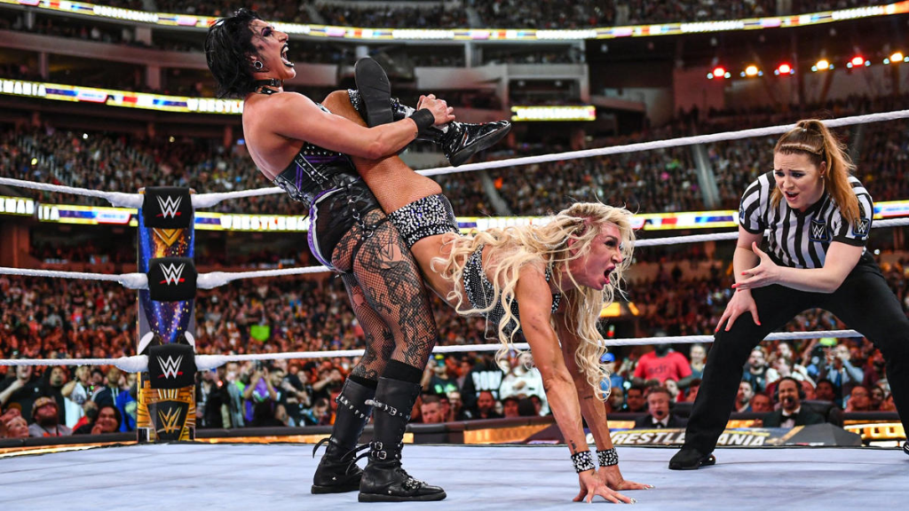 Rhea Ripley almost bends Charlotte Flair in half in front of a rowdy crowd at Sofi Stadium. | Agents of Fandom