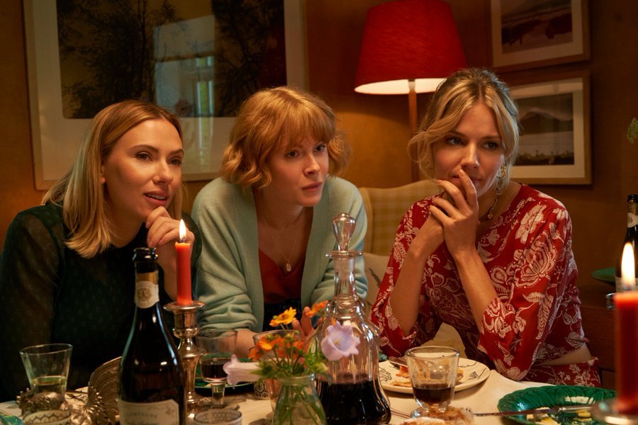 A scene from North Star with Scarlett Johansson, Sienna Miller, and Emily Beecham sitting at a dining table | TIFF 2023 | Agents of Fandom