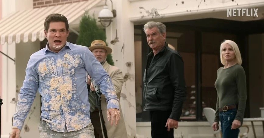 Adam Devine as Owen Browning, Michael Rooker as Agent Oldham, Pierce Brosnan as Billd McDermott, and Ellen Barkin as Lilly McDermott | Agents of Fandom