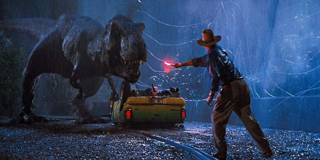 Sam Neill as Grant holding a flare, distracting a T. rex in Jurassic Park | best 90s movies | Agents of Fandom