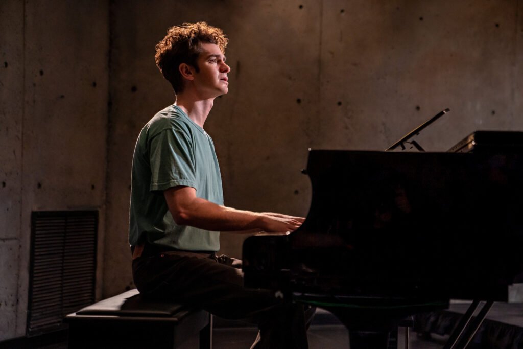 Andrew Garfield playing piano in 'Tick, Tick...Boom!' | Agents of Fandom