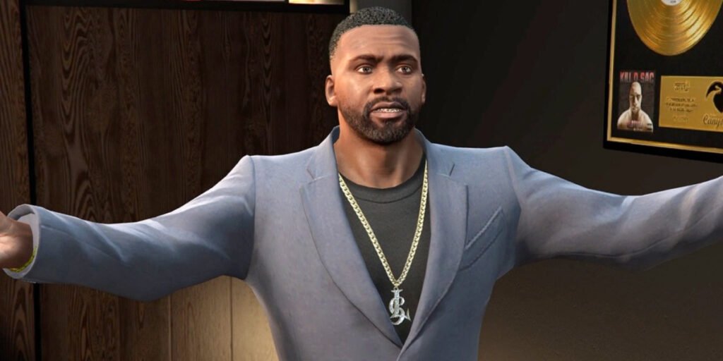 One of the Best GTA characters Franklin Clinton, voiced by Shawn Fonteno, standing in an office with a blue suit and chain | Agents of Fandom