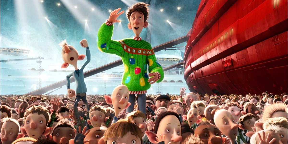 Arthur, voiced by James McAvoy standing with the Elves in Arthur Christmas | Agents of Fandom | Best Christmas Movies