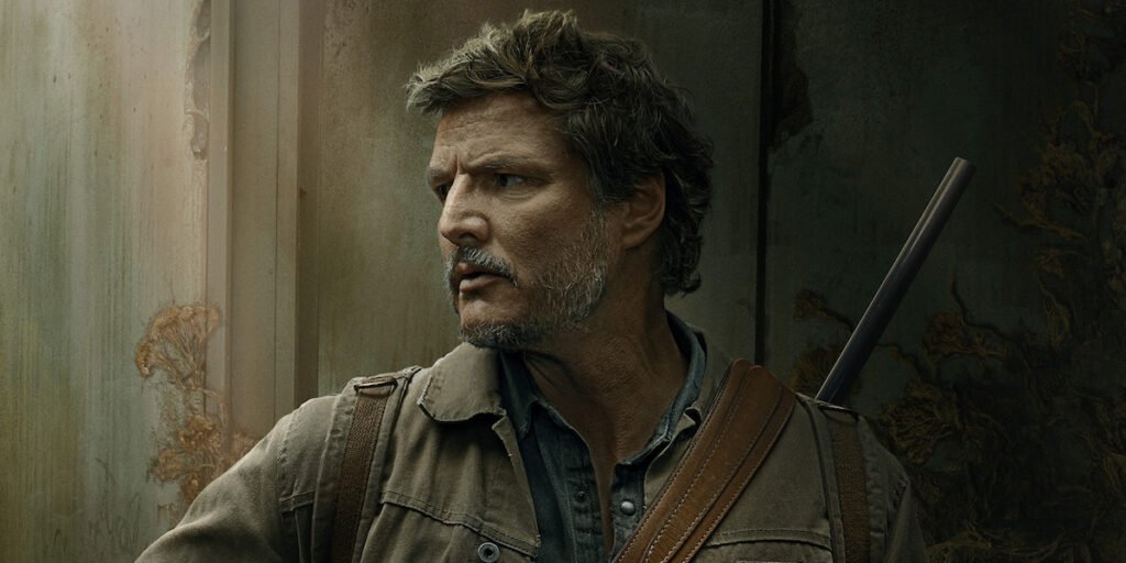 Pedro Pascal as Joel Miller with a gun over his shoulder in HBO's The Last of Us  | Agents of Fandom