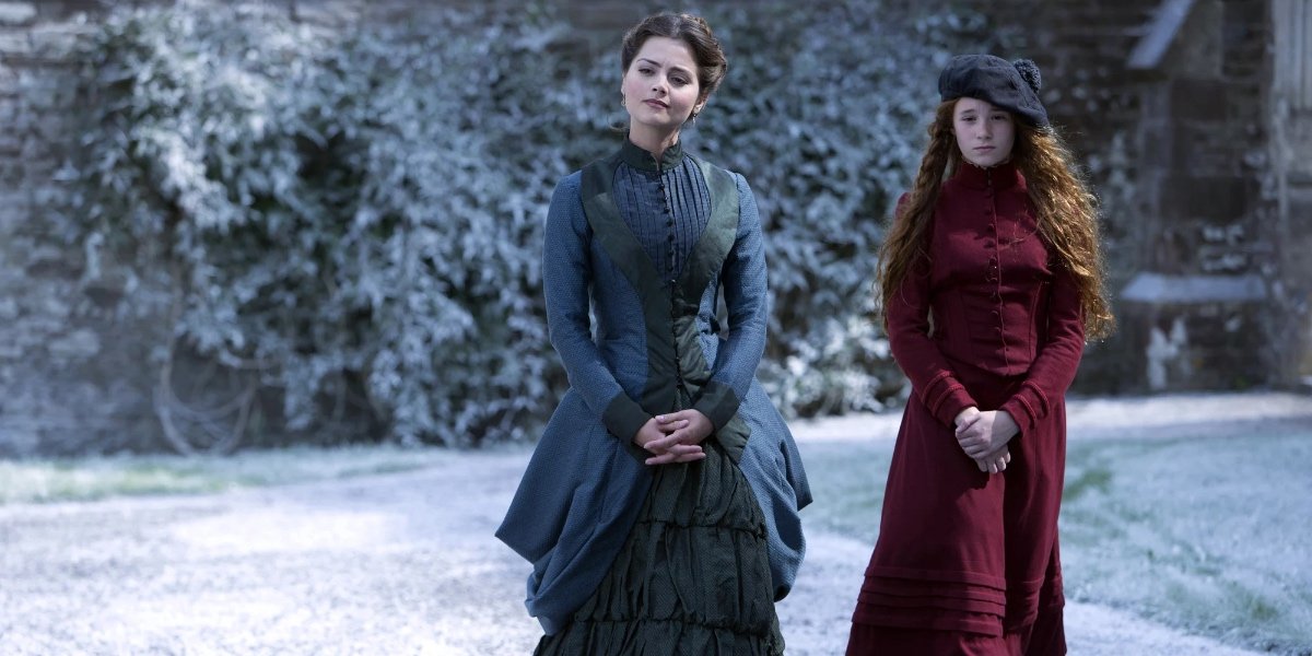 Jenna Coleman as Clara Oswald standing in the snow in Doctor Who's "The Snowmen" | Agents of Fandom