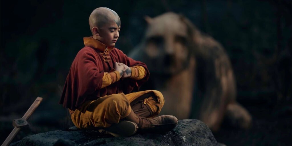 Gordon Cormier as Aang sitting on a rock meditating in Avatar: The Last Airbender | Agents of Fandom