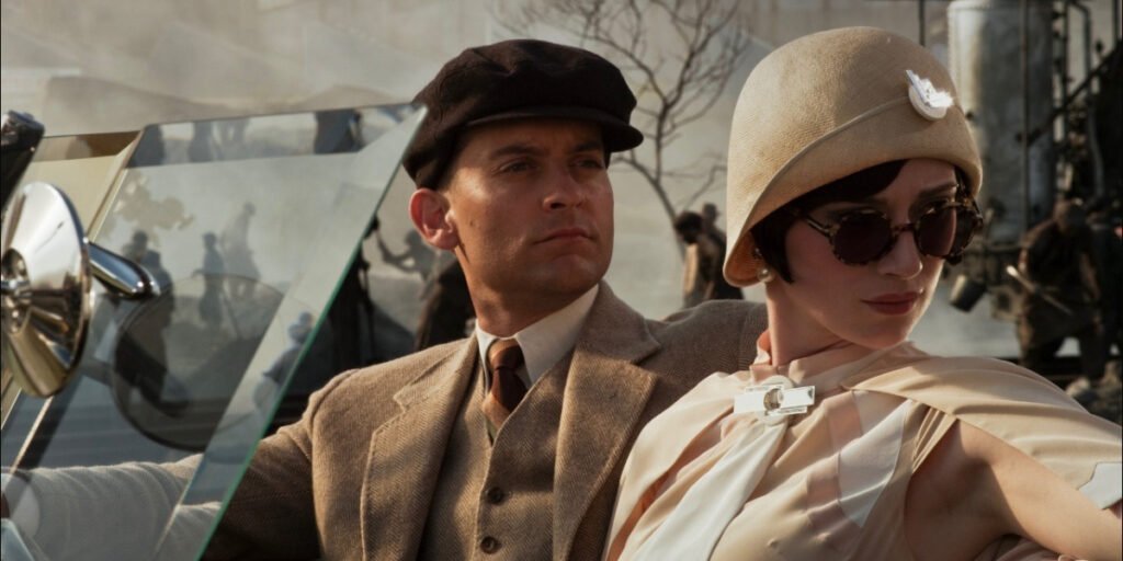 Tobey Maguire and Elizabeth Debicki sitting in a car together in The Great Gatsby | Agents of Fandom