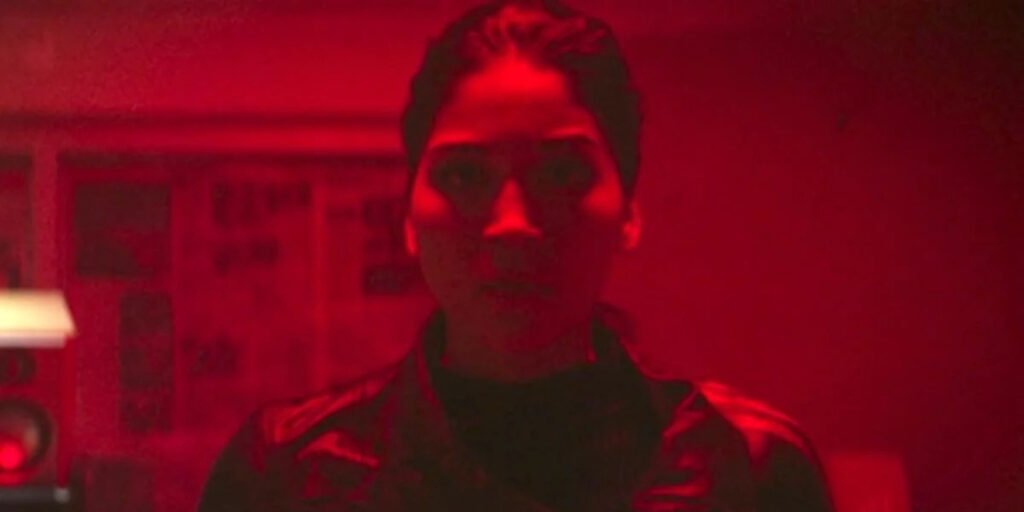 Alaqua Cox as Maya Lopez standing in red light | Agents of Fandom