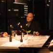 Alaqua Cox as Maya Lopez, and Vincent D'Onofrio as Wilson Fisk sitting at a dinner table together with an ASL interpereter standing beside them | Agents of Fandom