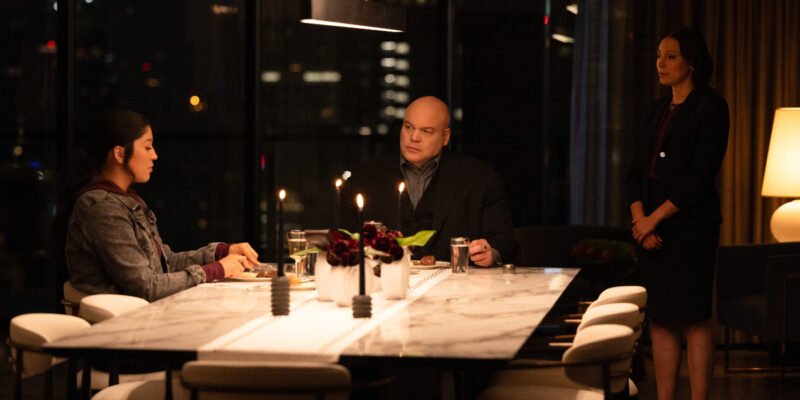 Alaqua Cox as Maya Lopez, and Vincent D'Onofrio as Wilson Fisk sitting at a dinner table together with an ASL interpereter standing beside them | Agents of Fandom