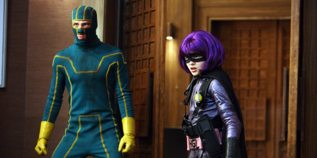 Aaron Taylor-Johnson and Chloe Grace Moretz in their superhero costumes ready to fight in Kick-Ass | Agents of Fandom