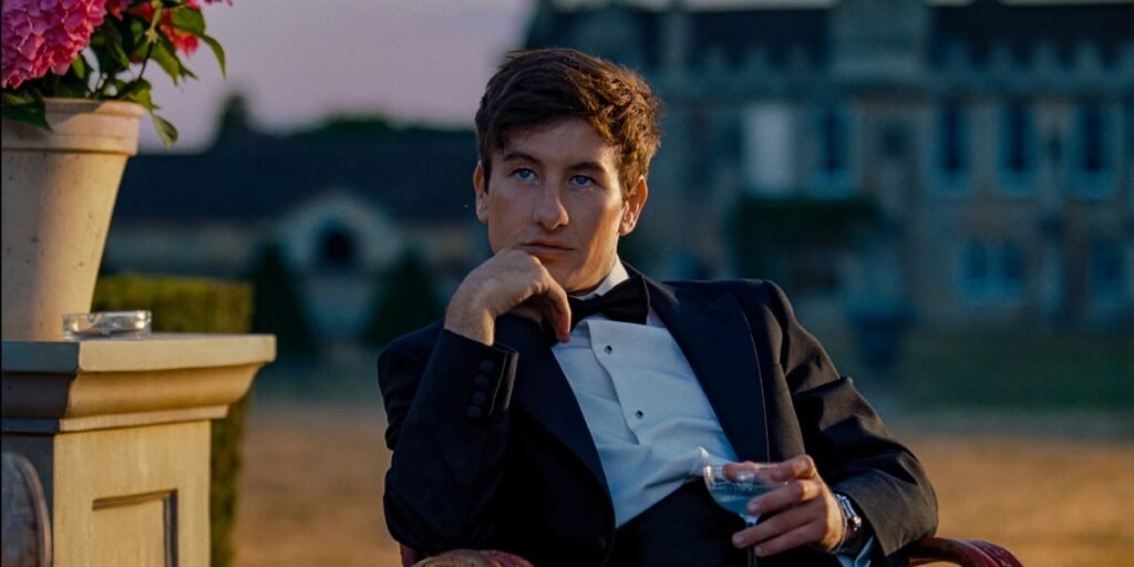Oliver Quick, portrayed by Barry Keoghan, sat staring dressed in a suit in Saltburn | Agents of Fandom