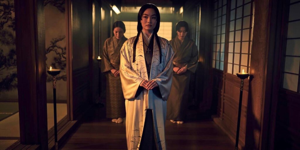 Anna Sawai as Mariko walking through a hall with two servants behind her | Agents of Fandom