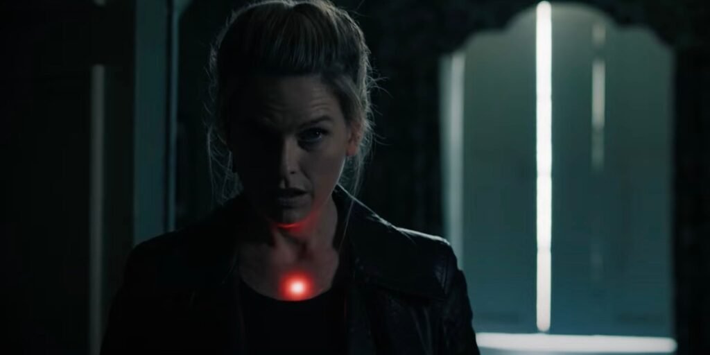 Cassie Holt (Alice Eve) has the red dot from a gun pointed at her chest in Cult Killer I Agents of Fandom